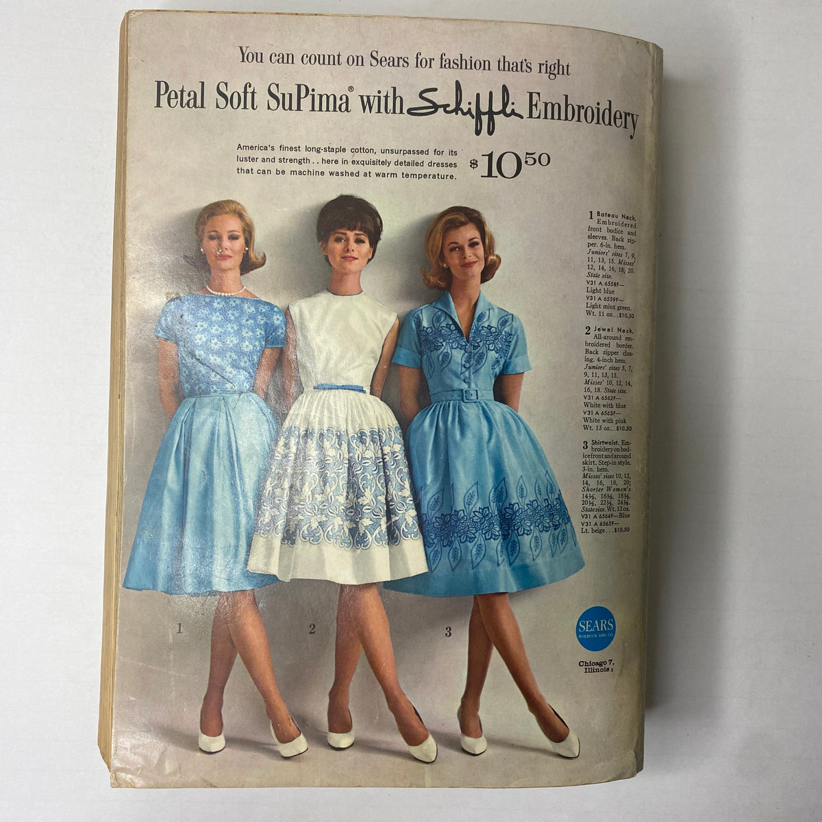 1963 Sears Classic Spring and Summer Catalog featuring stylish dresses in light blue with intricate embroidery, modeled by women and priced attractively.