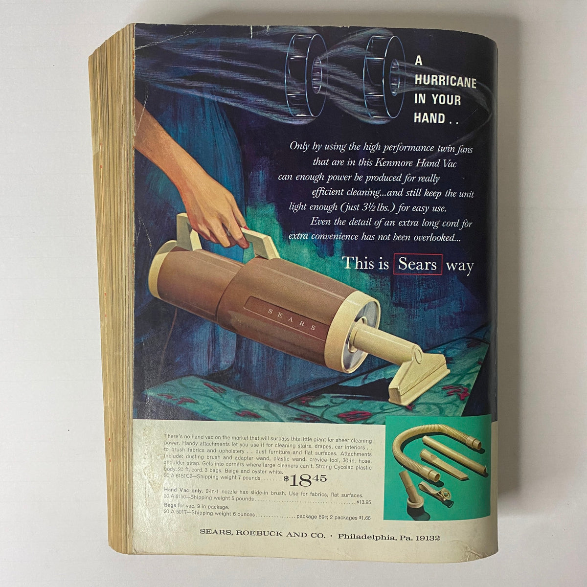 1965 Sears Spring and Summer Catalog page highlighting the Kenmore Hand Vac with a description of its lightweight design and cleaning features.