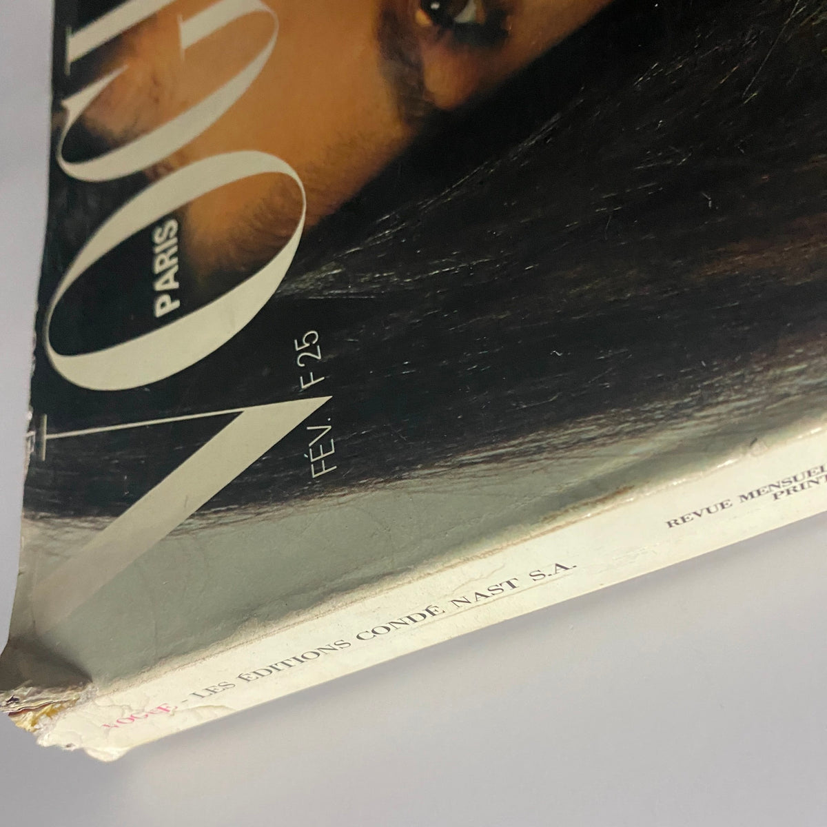 Vogue Paris Magazine February 1980 Janice Dickinson Cover, featuring a close-up of the iconic cover model's eye and part of the magazine title, showcasing vintage fashion history.