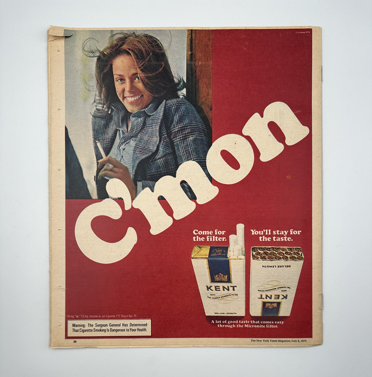 The New York Times Magazine July 6, 1975 cover advertisement showcasing a woman smiling prominently with the slogan 'C'mon' and promoting Kent cigarettes, reflecting the magazine's vintage style.
