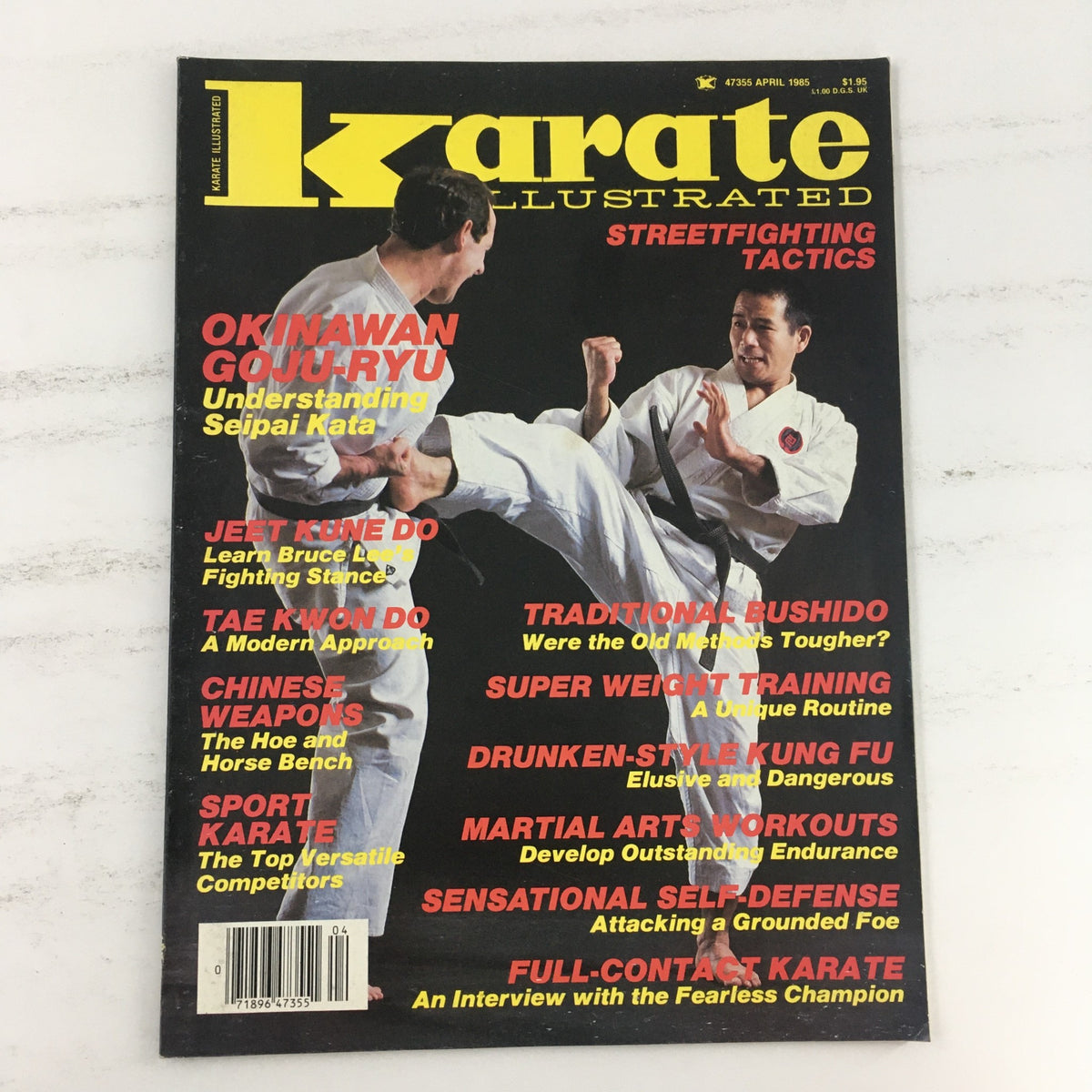 Cover of Karate Illustrated Magazine April 1985 Vol 16 #4 featuring a dynamic karate scene with two practitioners demonstrating streetfighting tactics and highlighting the Goju-Ryu style.