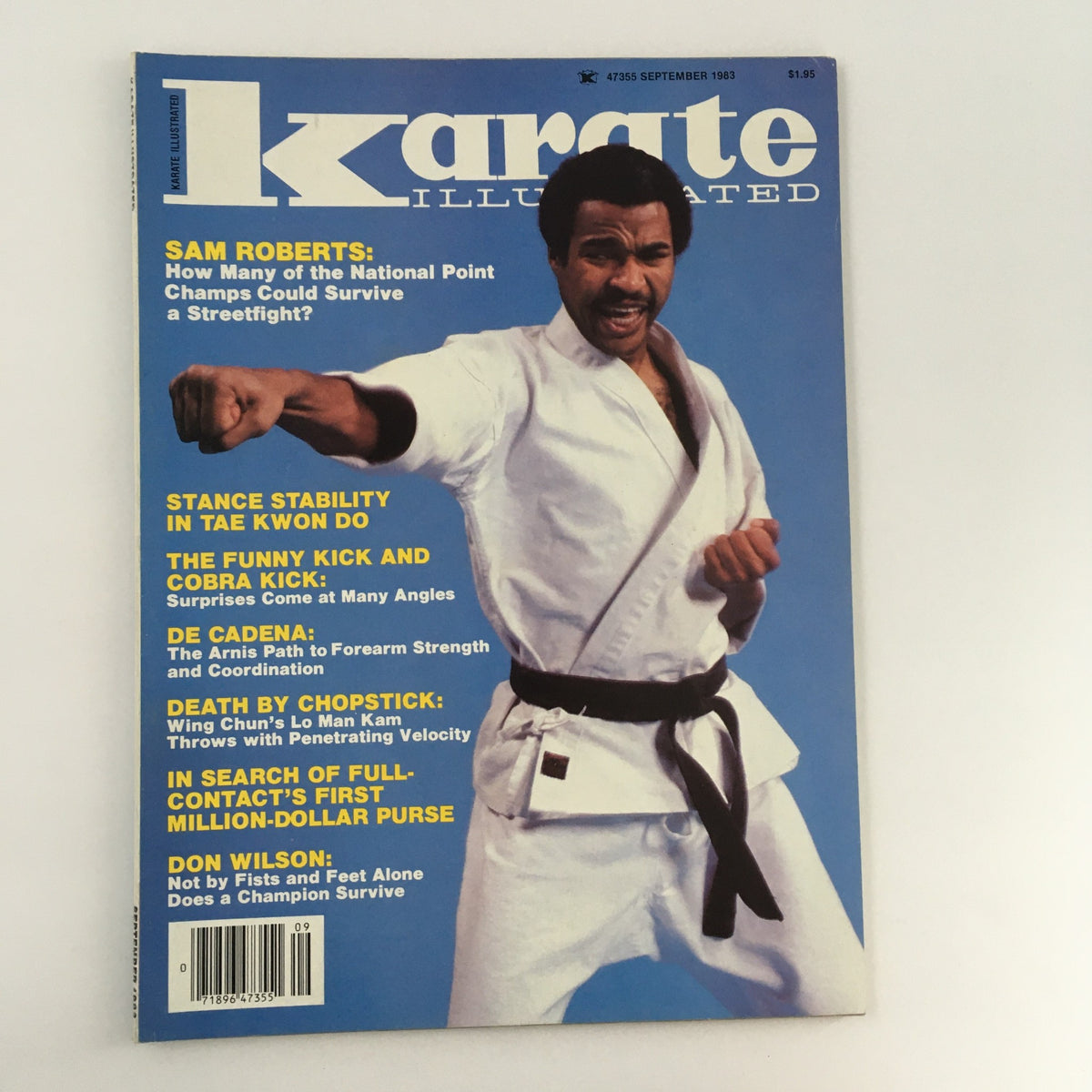 Cover of Karate Illustrated Magazine, September 1983, Volume 14, Issue #9 featuring a photo of martial artist Sam Roberts showcasing a punch, along with headlines highlighting martial arts topics and techniques.