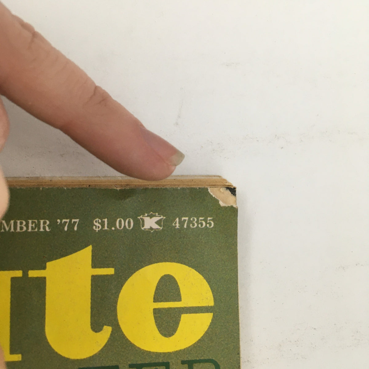 Top edge of Karate Illustrated Magazine September 1977 Vol 8 #9 marked with a price tag and publication details, showing signs of wear.