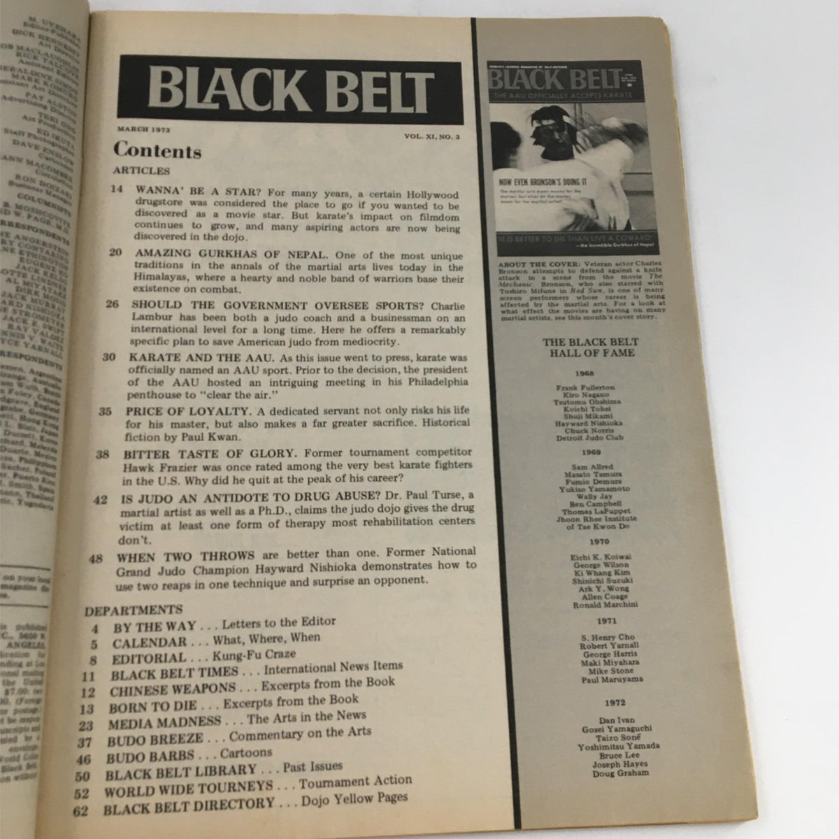 Black Belt Magazine March 1973 featuring contents page with articles listed about martial arts, including contributions from Charles Bronson and Charlie Lambur. The magazine shows signs of wear with visible rips and stains.