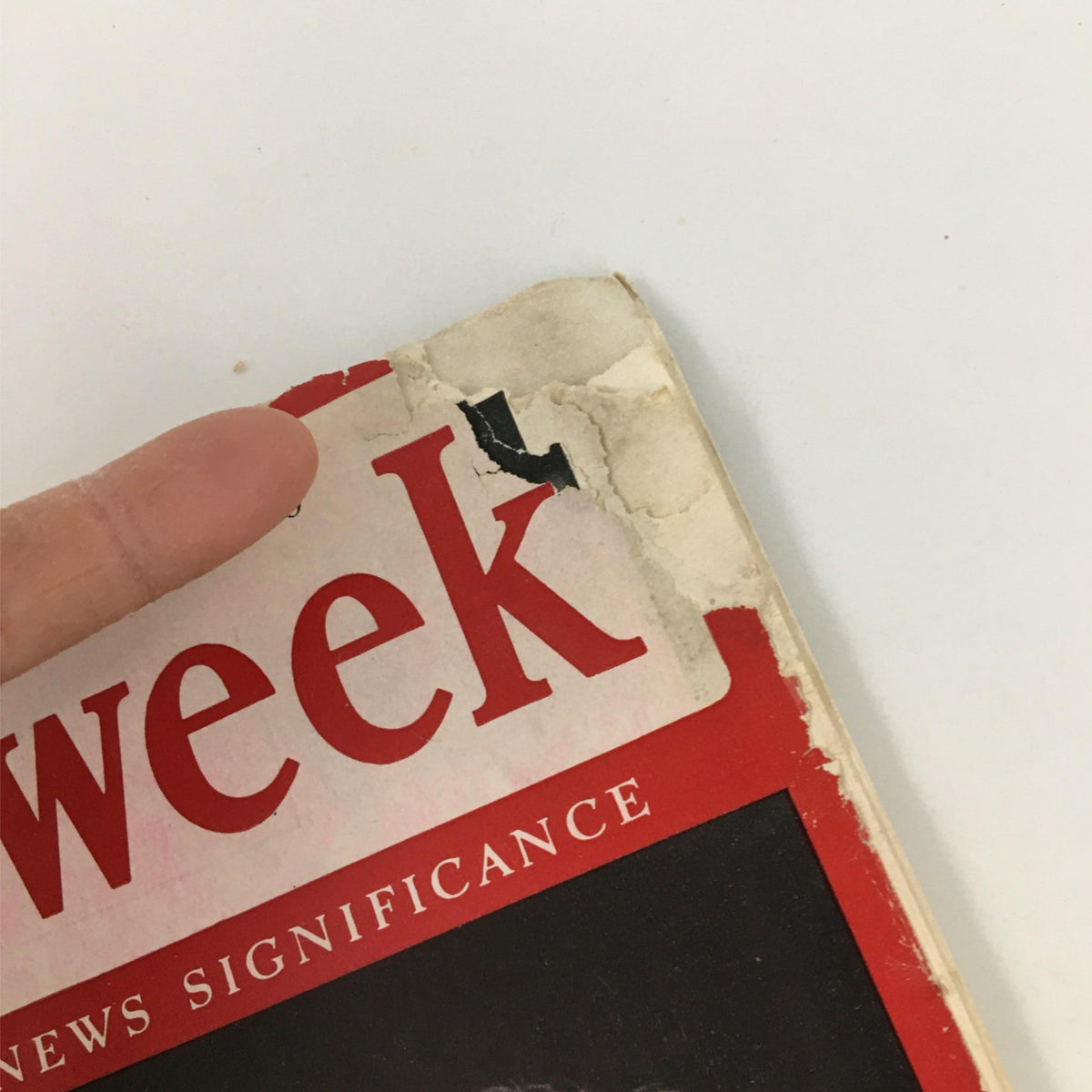 Close-up of the corner of the Newsweek Magazine from November 4, 1940 showing graphic wear and tear, emphasizing its vintage charm and historical context.