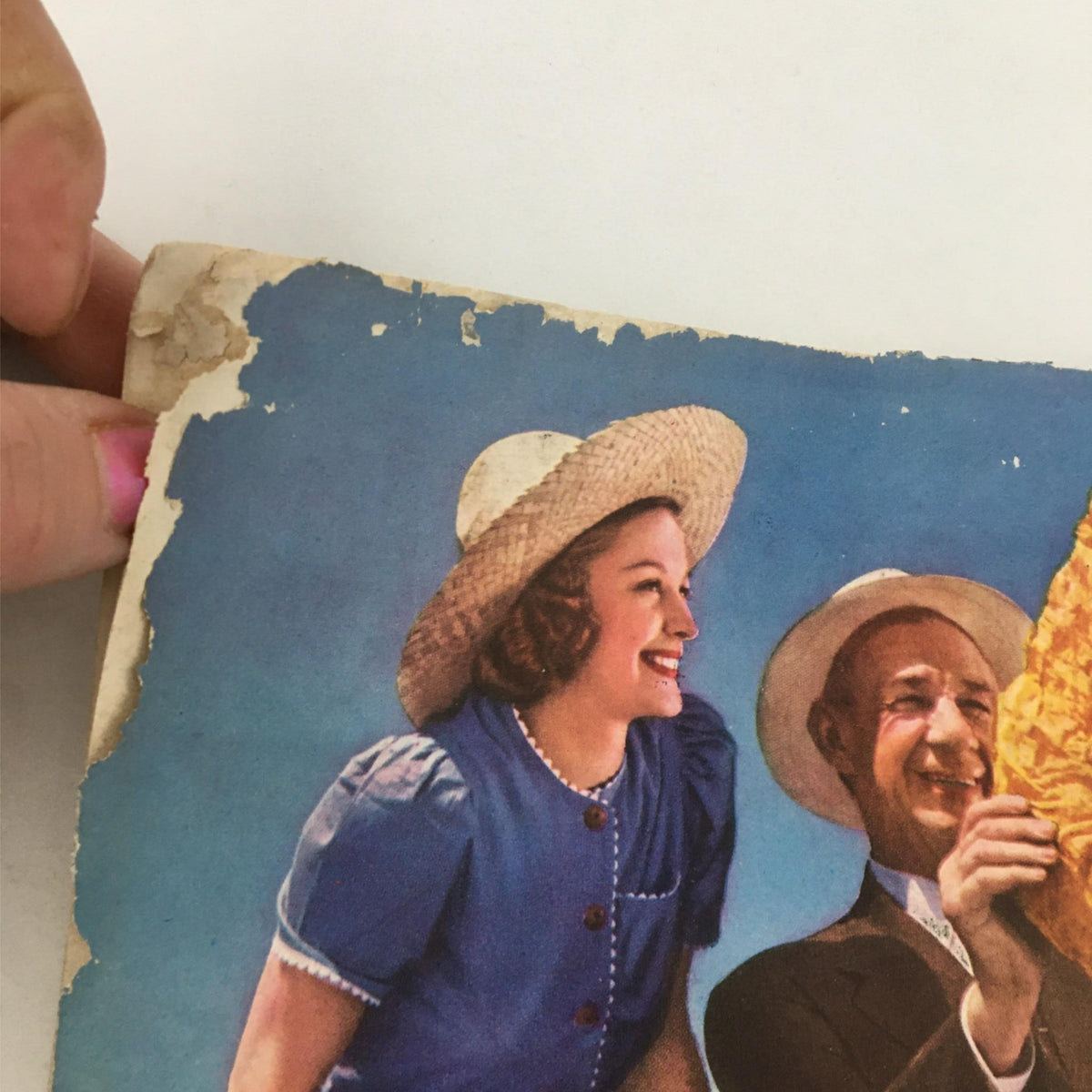 Detail of the back cover of Newsweek Magazine from November 4, 1940, showing a vintage advertisement with two people and tobacco leaves, reflecting historical advertising styles.