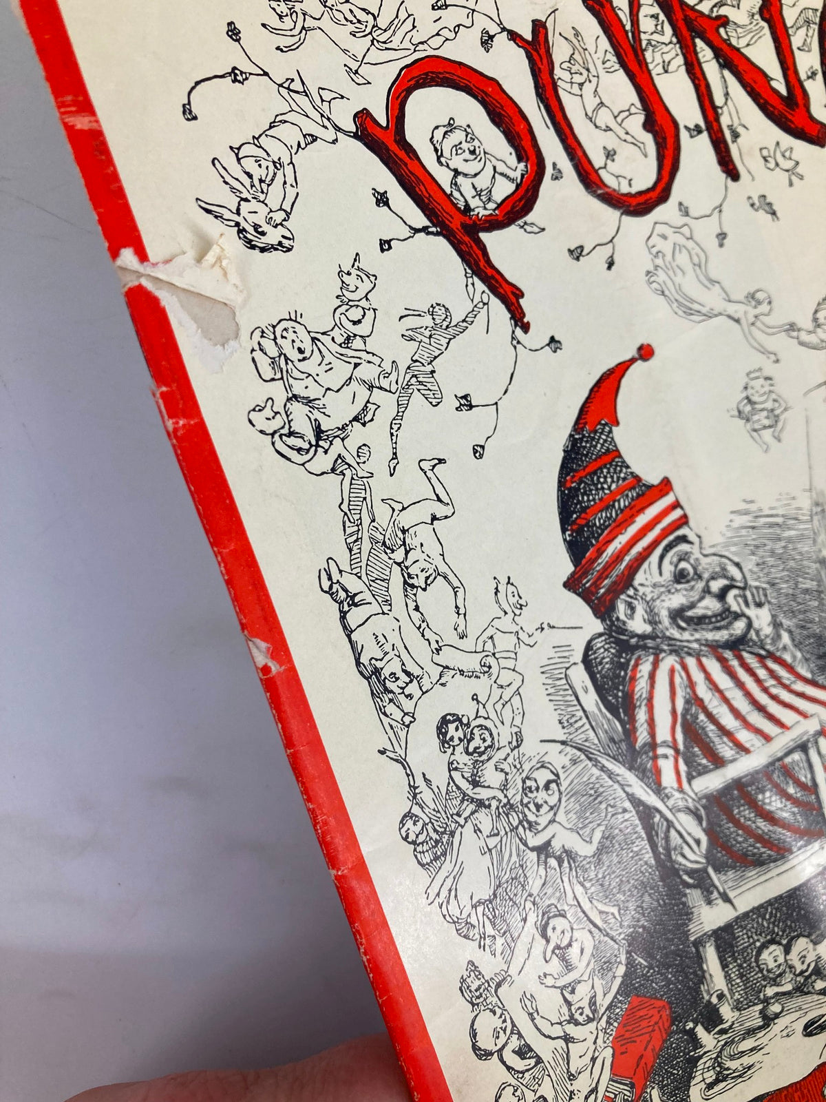 Detail of VTG Punch Magazine July 21 1954 cover showing whimsical cartoons and wear, including a corner tear.