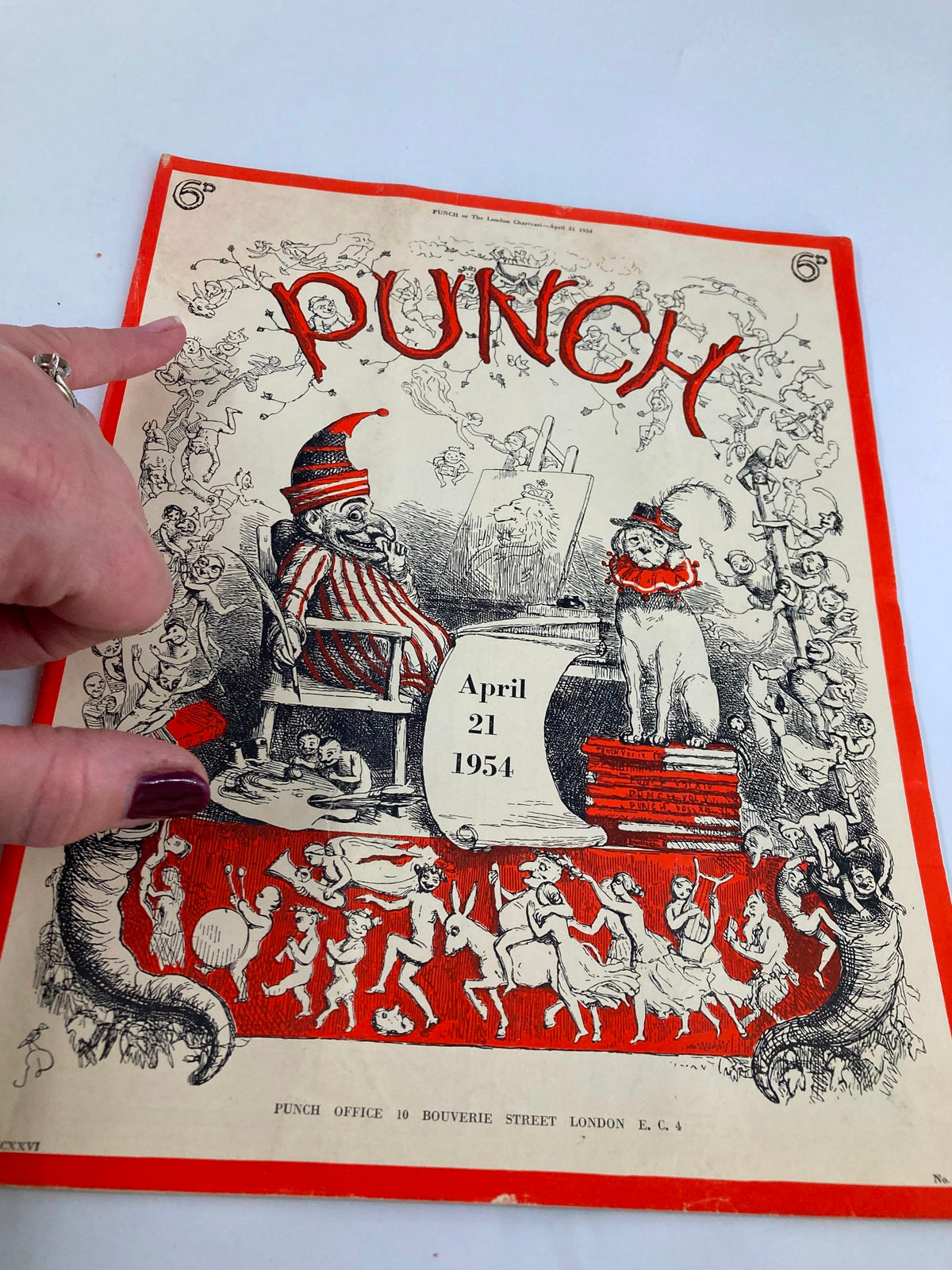 Close-up of the cover of VTG Punch Magazine from April 21, 1954, highlighting whimsical artwork and the date prominently featured.