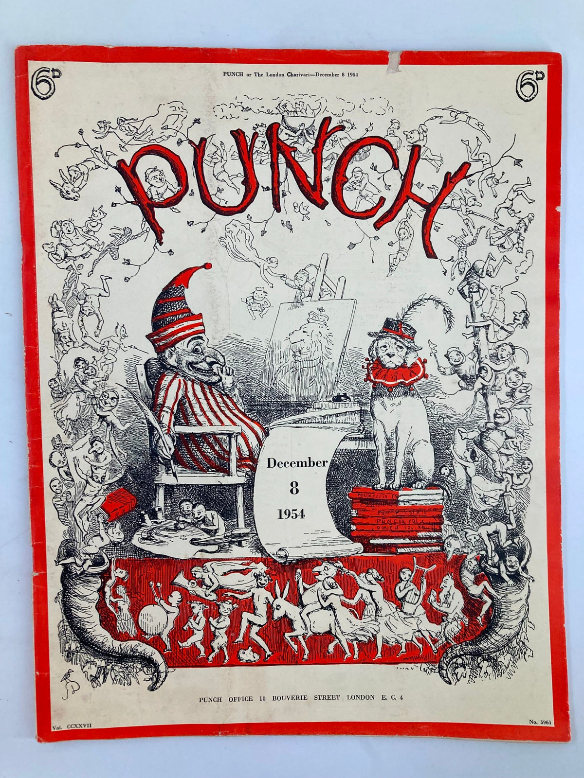 Cover of VTG Punch Magazine December 8 1954 Vol 227 Issue No. 5961 featuring humorous illustrations, a clown, and a cat on books.