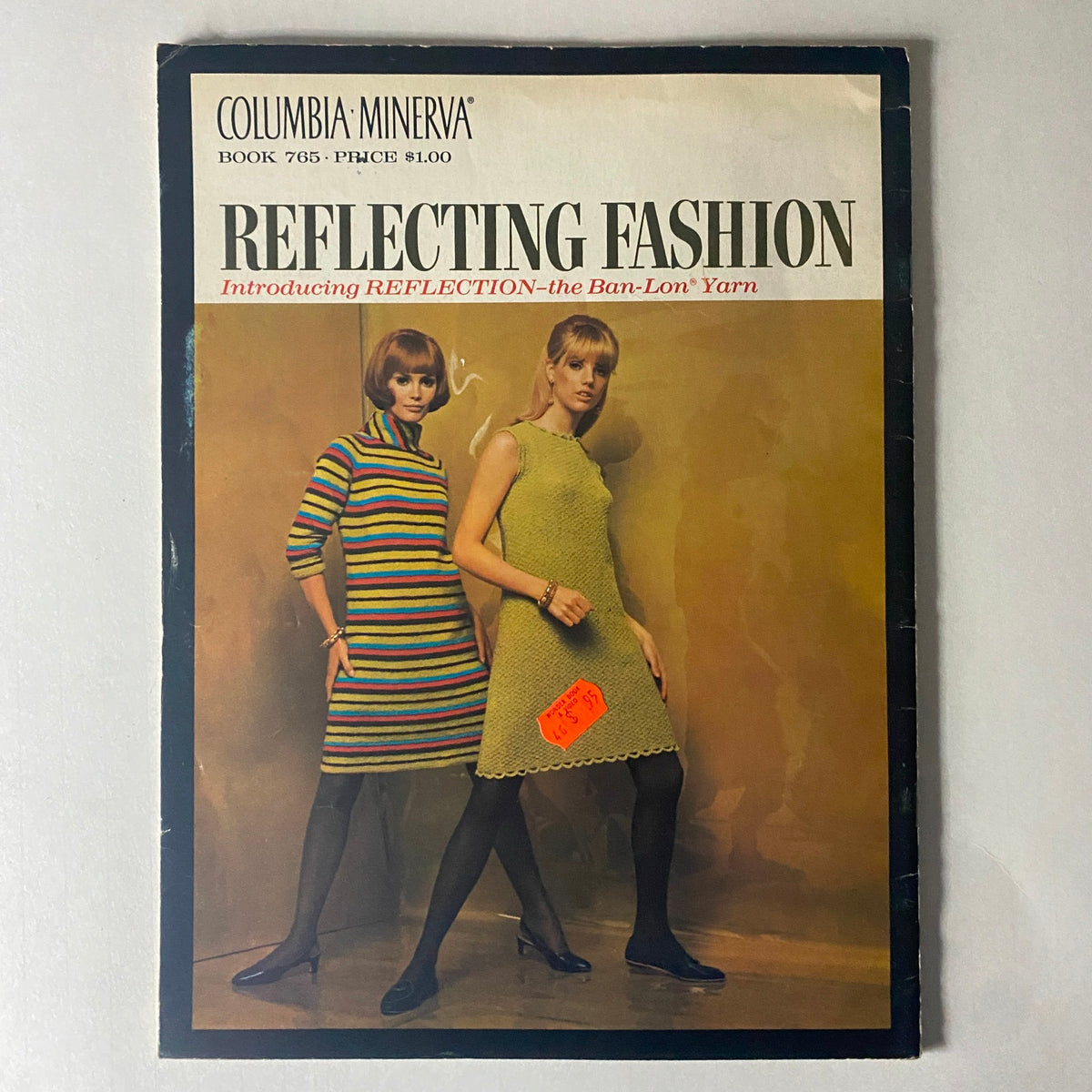 Another view of the 1967 Columbia Minerva Reflecting Fashion cover, featuring two women in stylish knit dresses made from Ban-Lon yarn, with a price tag still visible.