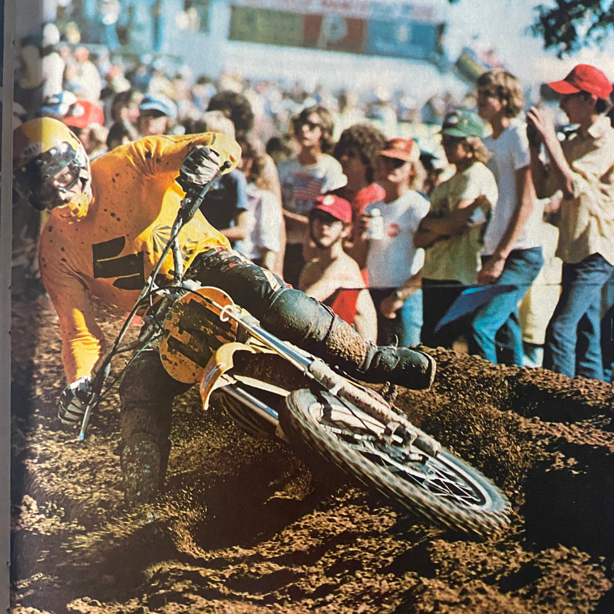 Cycle World Magazine March 1976 photo of a motocross event with a rider in action, highlighting motorcycle racing excitement.