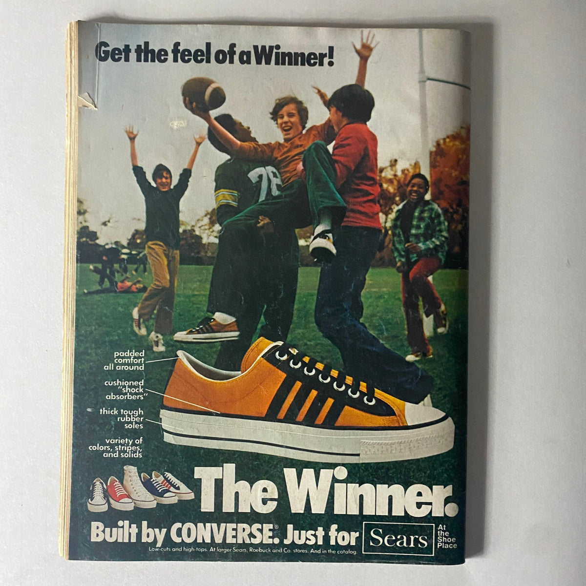 Advertisement from a vintage magazine promoting Converse sneakers, emphasizing comfort and style, labeled 'The Winner'.