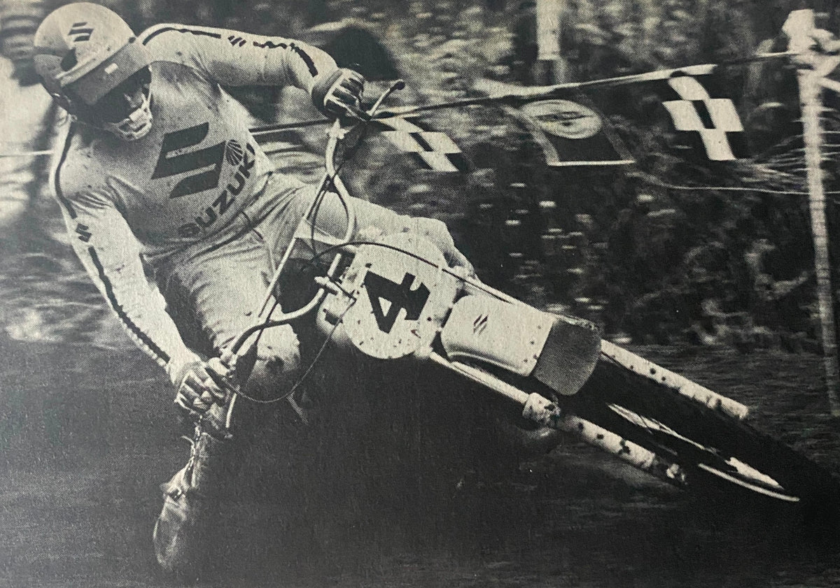 Cycle World Magazine October 1975 image of a Suzuki rider during a motocross event, highlighting the competition spirit of the era.