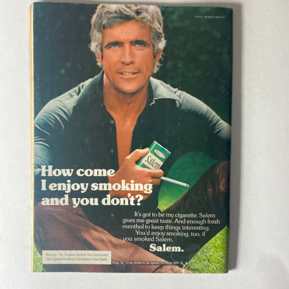Cover of Cycle World Magazine July 1976 featuring a man holding Salem cigarettes with the tagline, 'How come I enjoy smoking and you don’t?' showcasing the vintage advertisement style.