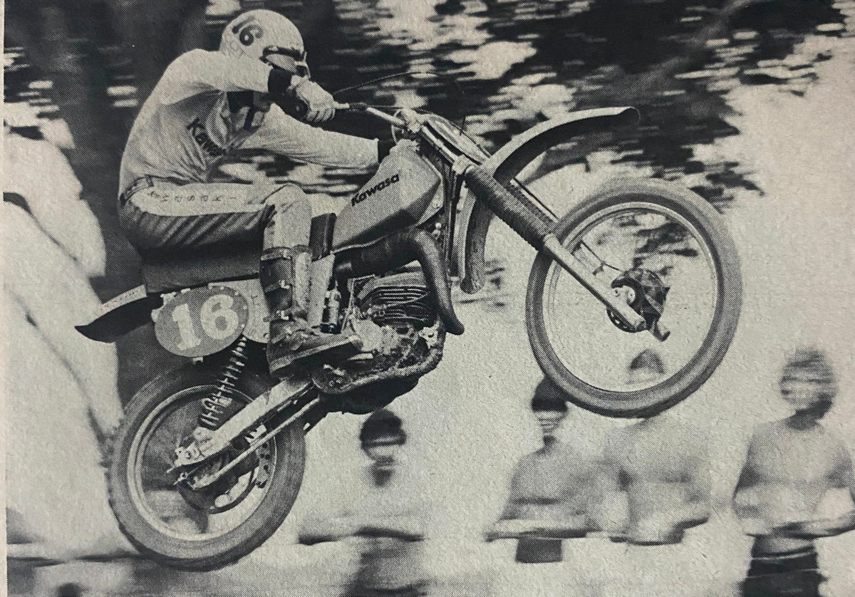 Historic image of a racer on a Kawasaki motorcycle during a jump, featured in Cycle Magazine November 1978.