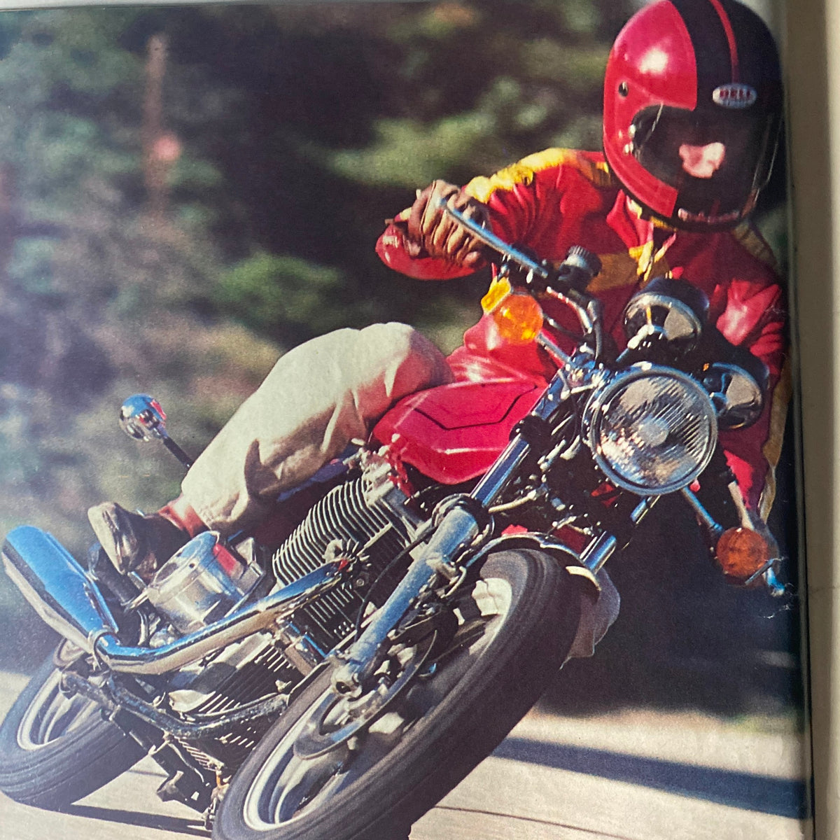 A close-up action shot of a rider on a motorcycle from Cycle Guide Magazine June 1978, emphasizing the performance of the vehicle.