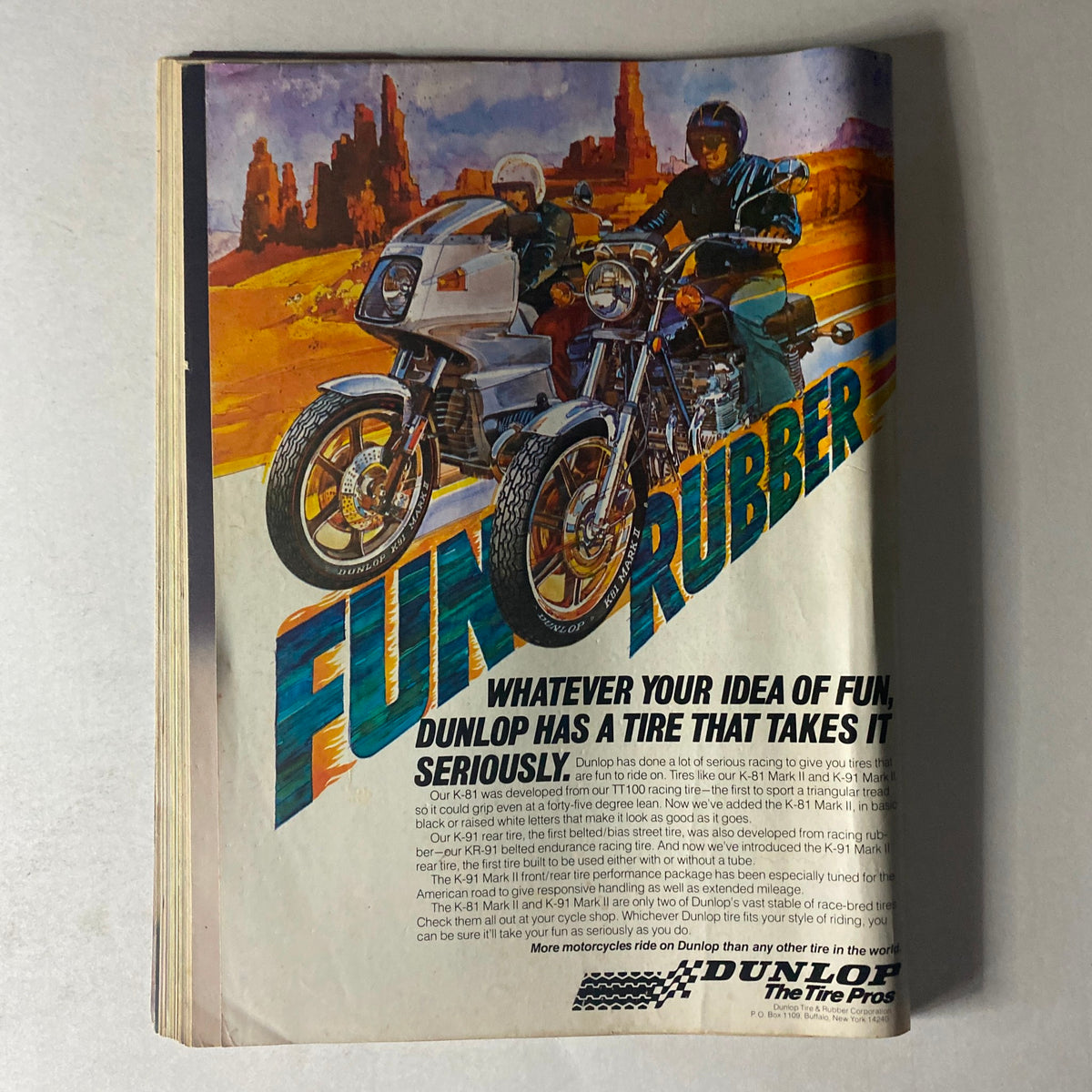Advertisement from Cycle Guide Magazine June 1978 featuring Dunlop tires with motorcycles on a scenic backdrop, highlighting the tagline 'FUN RUBBER'. This visual emphasizes motorcycle performance, appealing to vintage motorcycle enthusiasts and collectors.
