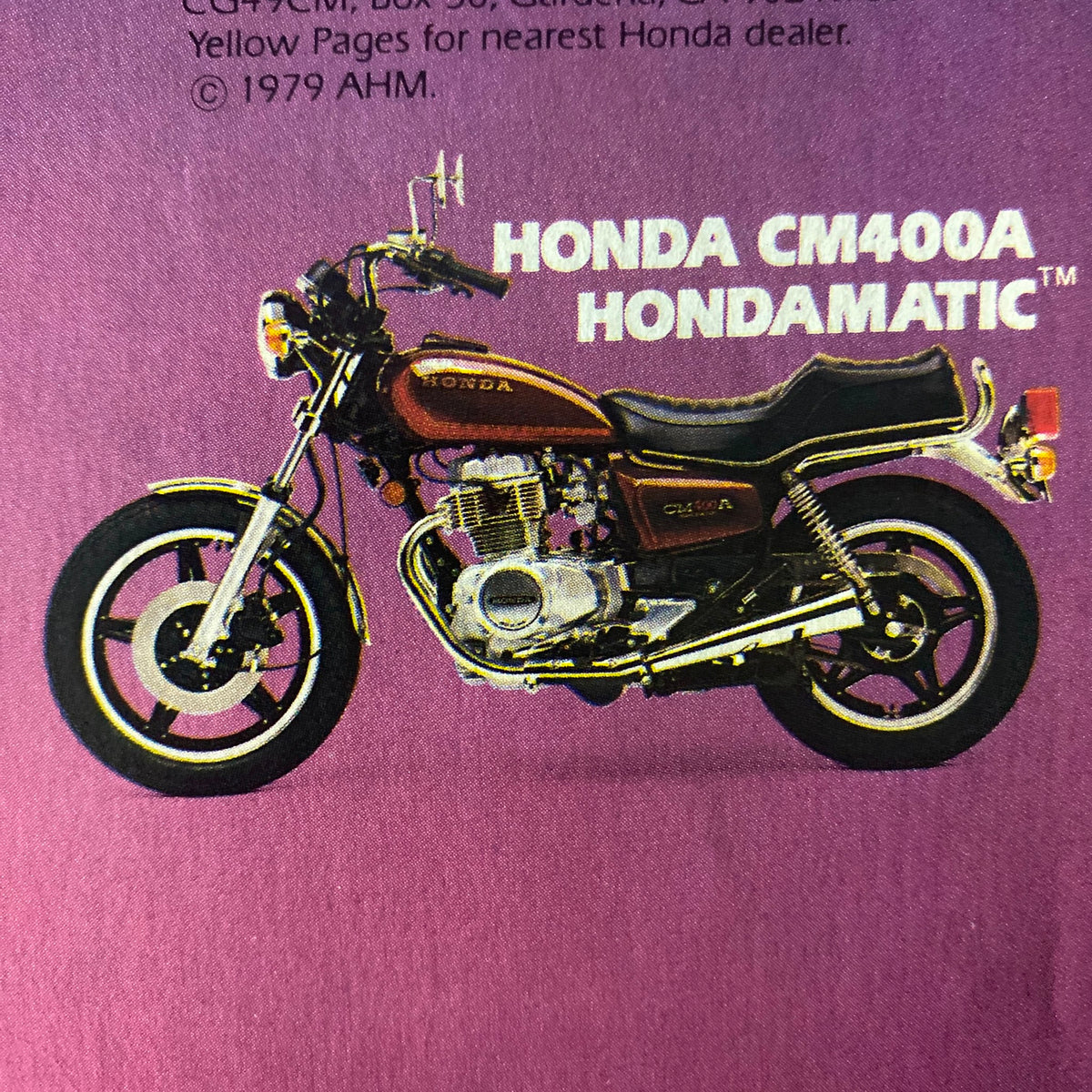 Cycle Guide Magazine April 1979 featuring a Honda CM400A Hondamatic motorcycle on a vibrant purple background.