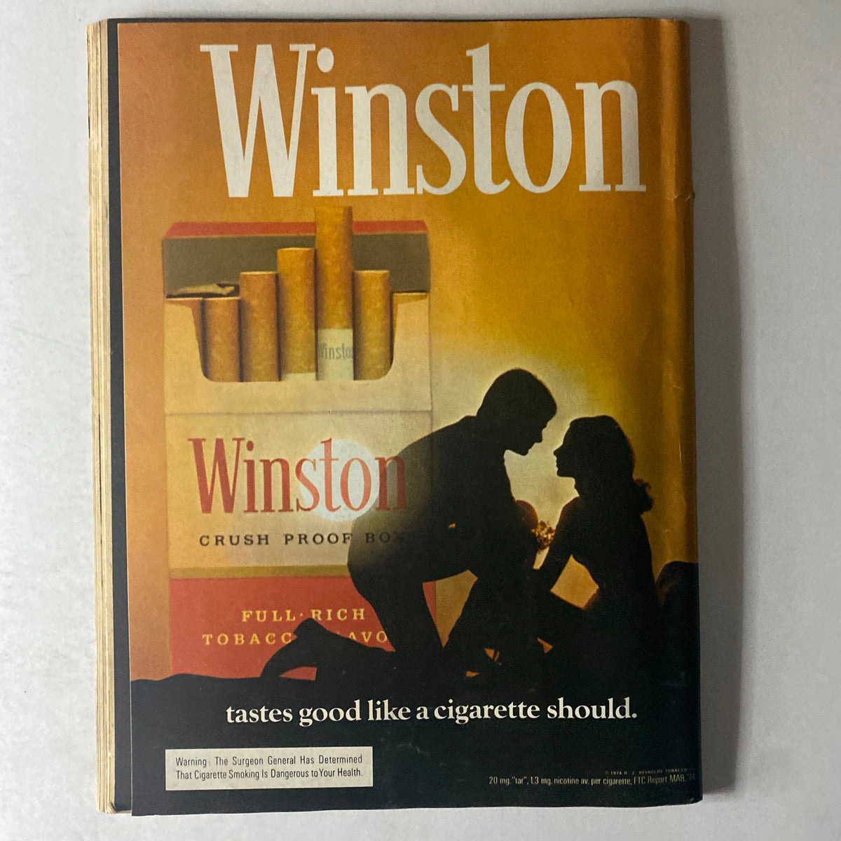 Cycle World Magazine October 1974, highlighting a vintage Winston advertisement depicting a couple with the Winston cigarette pack, emphasizing nostalgia and historic advertising.