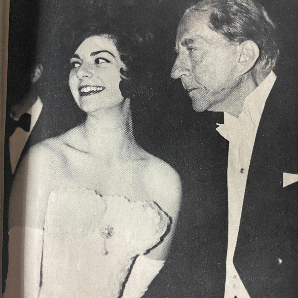 Black and white photo of a couple at a formal event, capturing the ambiance of the 1960s, featured in Scene Magazine June 1961.