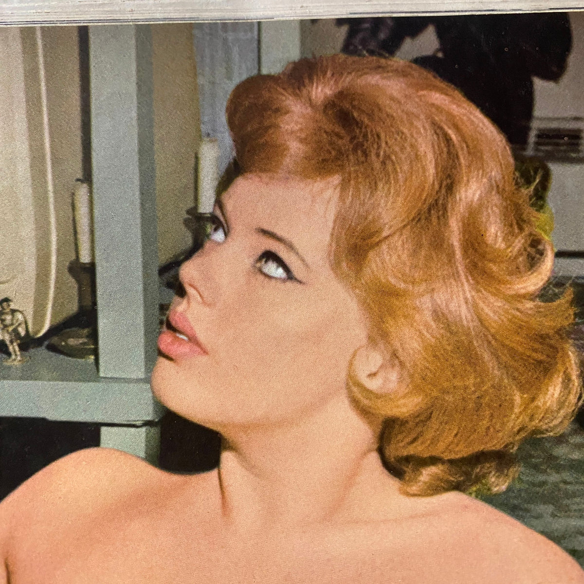 Close-up of a woman featured on the cover of Monsieur Magazine November 1965, showcasing mid-century beauty with vintage hair and makeup.