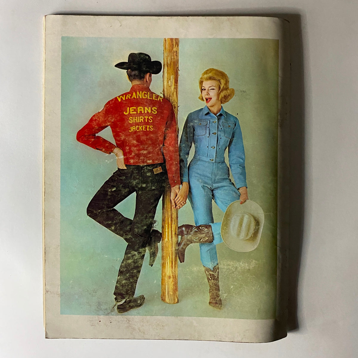 Back cover of The Dude Magazine November 1960 featuring a vintage advertisement with models showcasing Wrangler clothing, reflecting the fashion trends of the era.