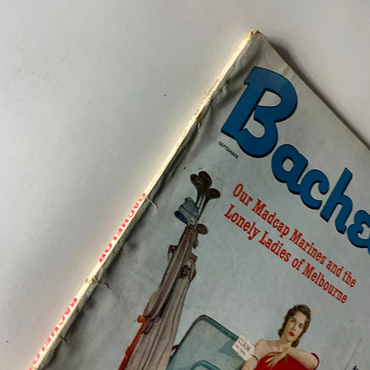 Close-up view of the Bachelor Magazine's September 1958 cover, showcasing the title 'The Deadly Dream of Danny April'. It prominently features the magazine's title and highlights the theme of 'Our Madcap Marines and the Lonely Ladies of Melbourne'.