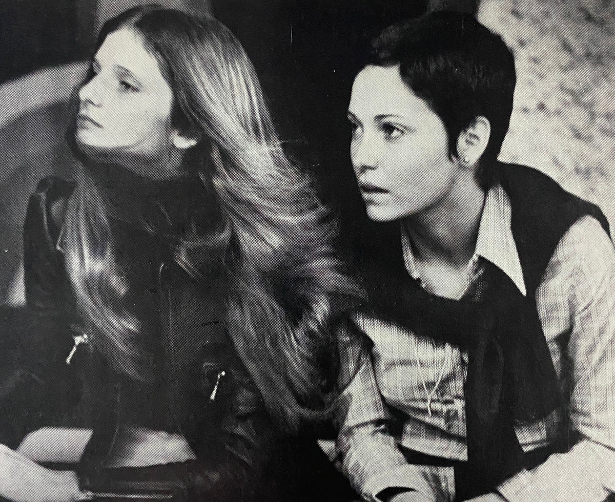 Black and white photograph of two young women in 1970s attire, featured in Viva Magazine November 1973, reflecting the era's style and cultural exchanges.