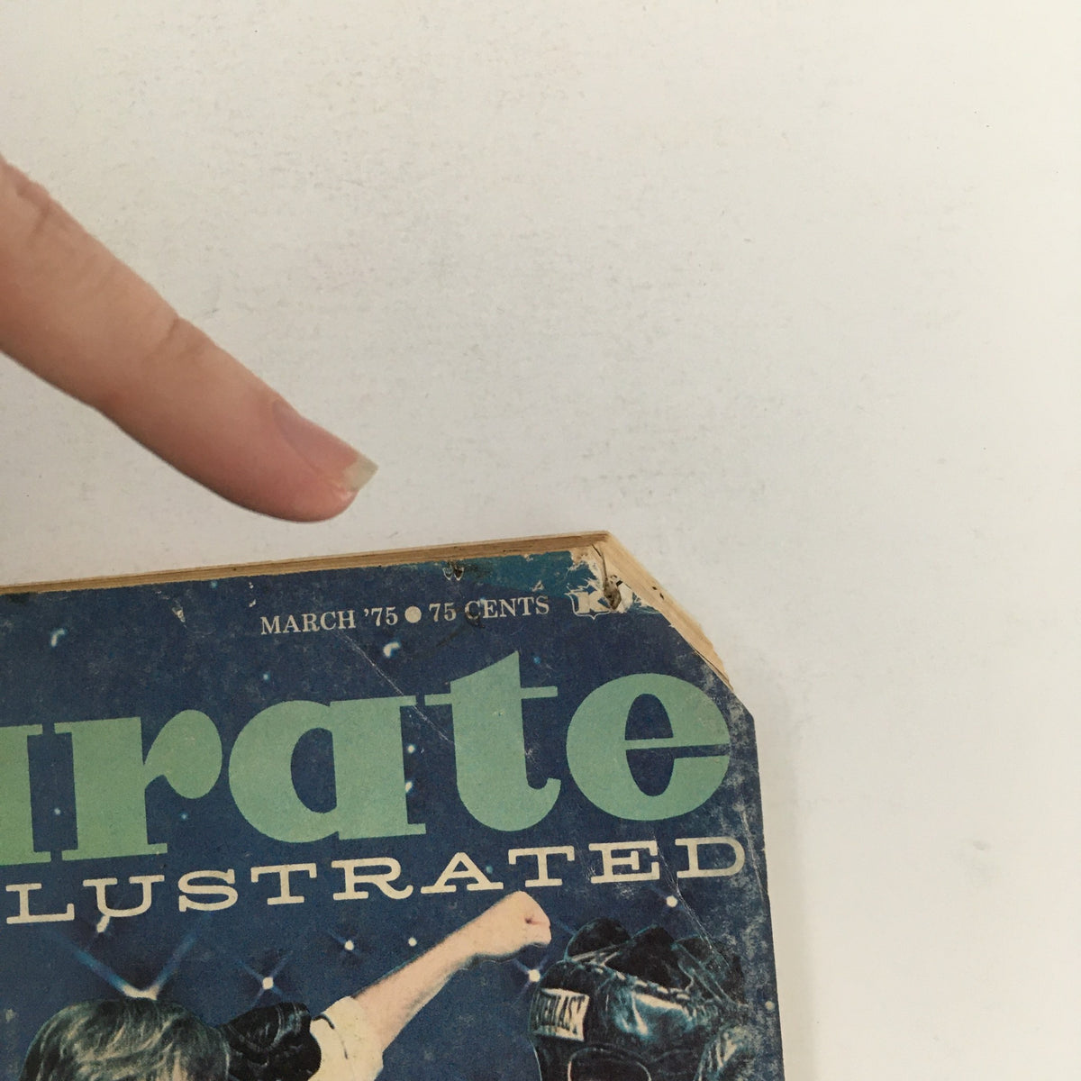 Close-up of the top corner of Karate Illustrated Magazine March 1975 Vol 6 #3 displaying the publication date and price. Features an image of two karate practitioners in a duel.