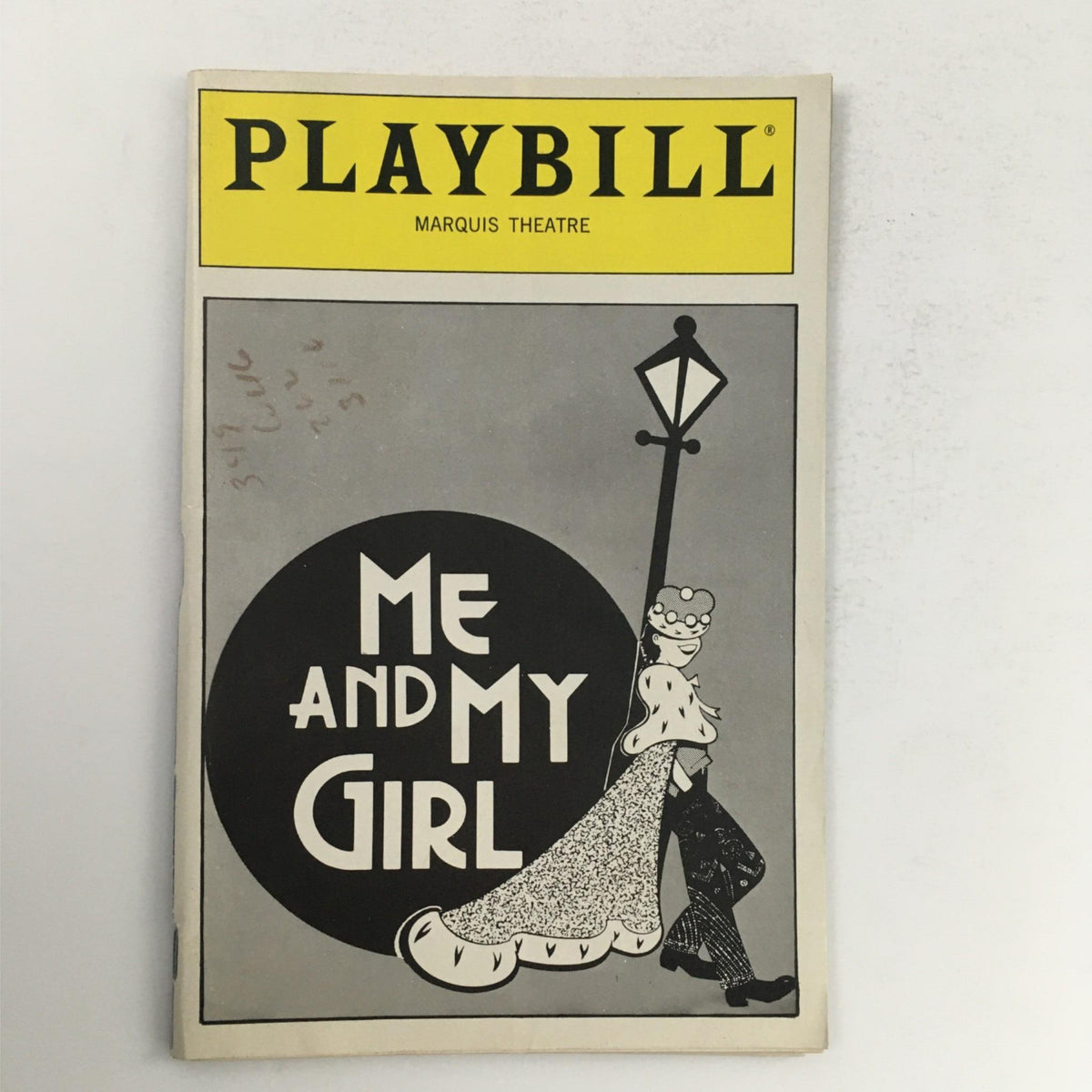 1989 Playbill for 'Me and My Girl' at the Marquis Theatre, showcasing a playful illustration of characters in a vintage style, emphasizing its role as a collectible piece of Broadway memorabilia.