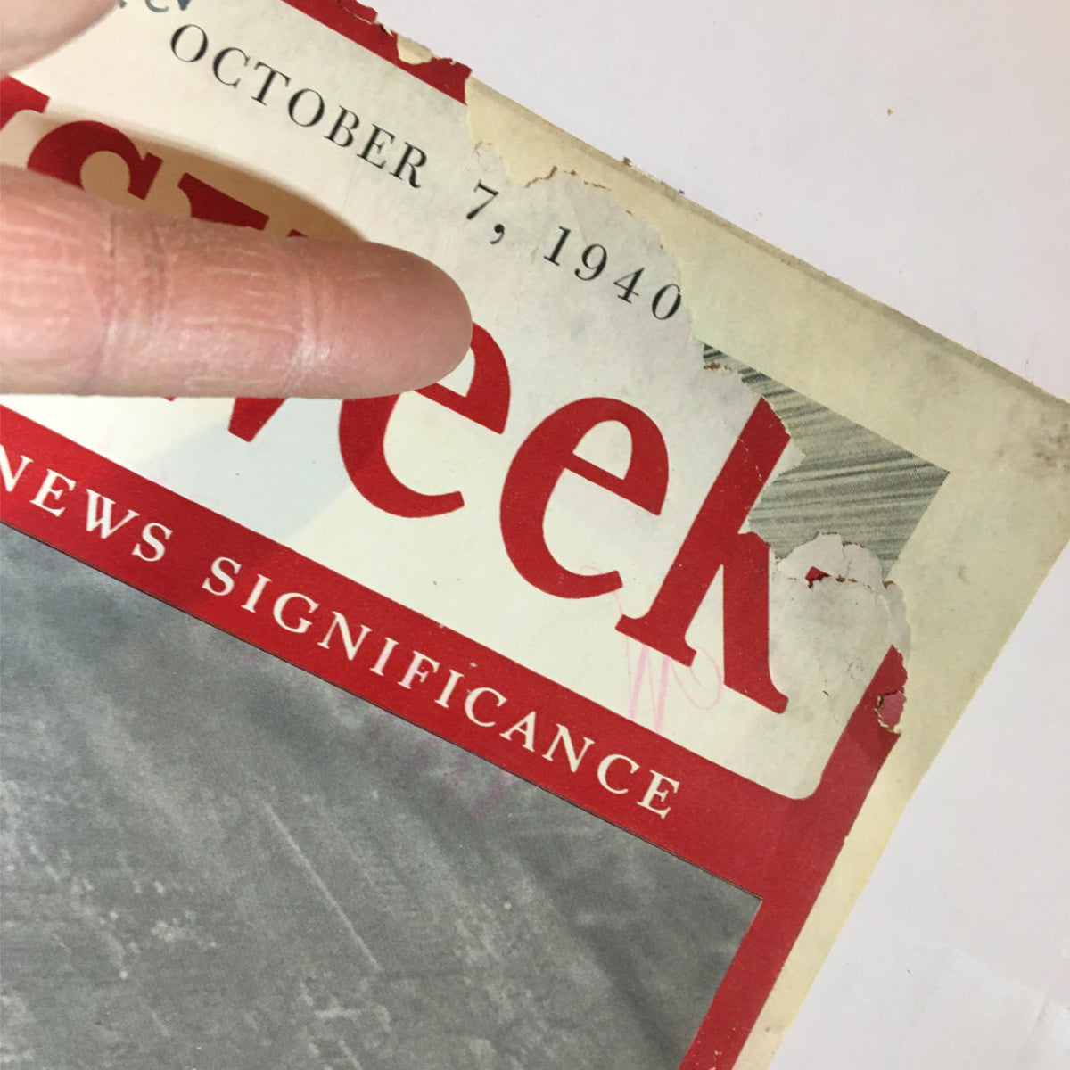 Close-up of Newsweek Magazine October 7, 1940 cover showing the date and title 'Power in the Skies: New Wings for America' with visible wear and tear.
