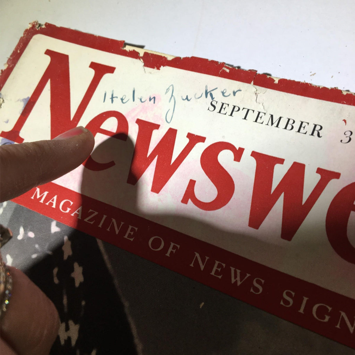 Close-up of the cover of Newsweek Magazine dated September 30, 1940, showing a handwritten name, capturing the vintage essence of the publication.