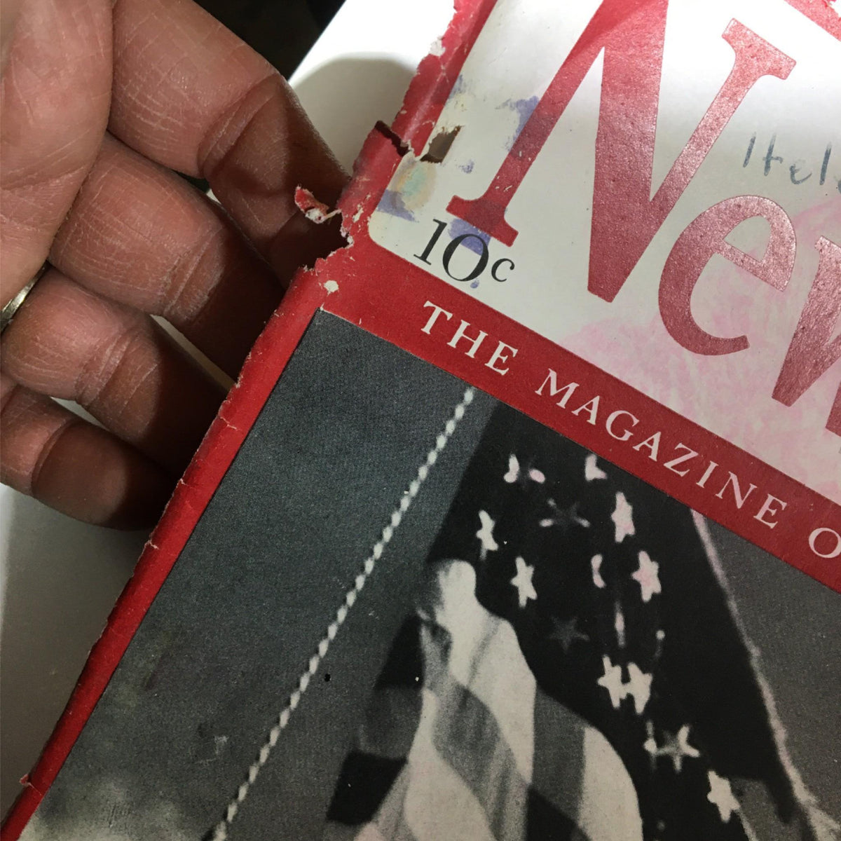 Detail of the damaged edge of Newsweek Magazine, September 30, 1940, illustrating the wear and tear of this historical collectible.