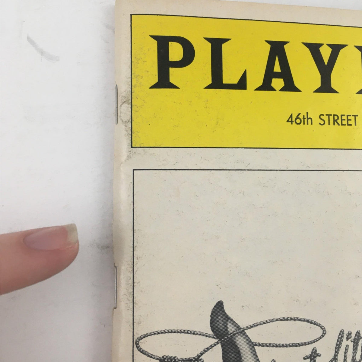 Side view of the 1981 Playbill for The Best Little Whorehouse in Texas highlighting minor wear on the cover, indicative of its collectible status.