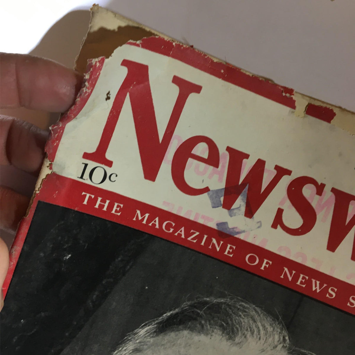 Detailed view of Newsweek Magazine July 22, 1940 cover with visible wear, showcasing its age and historical significance.