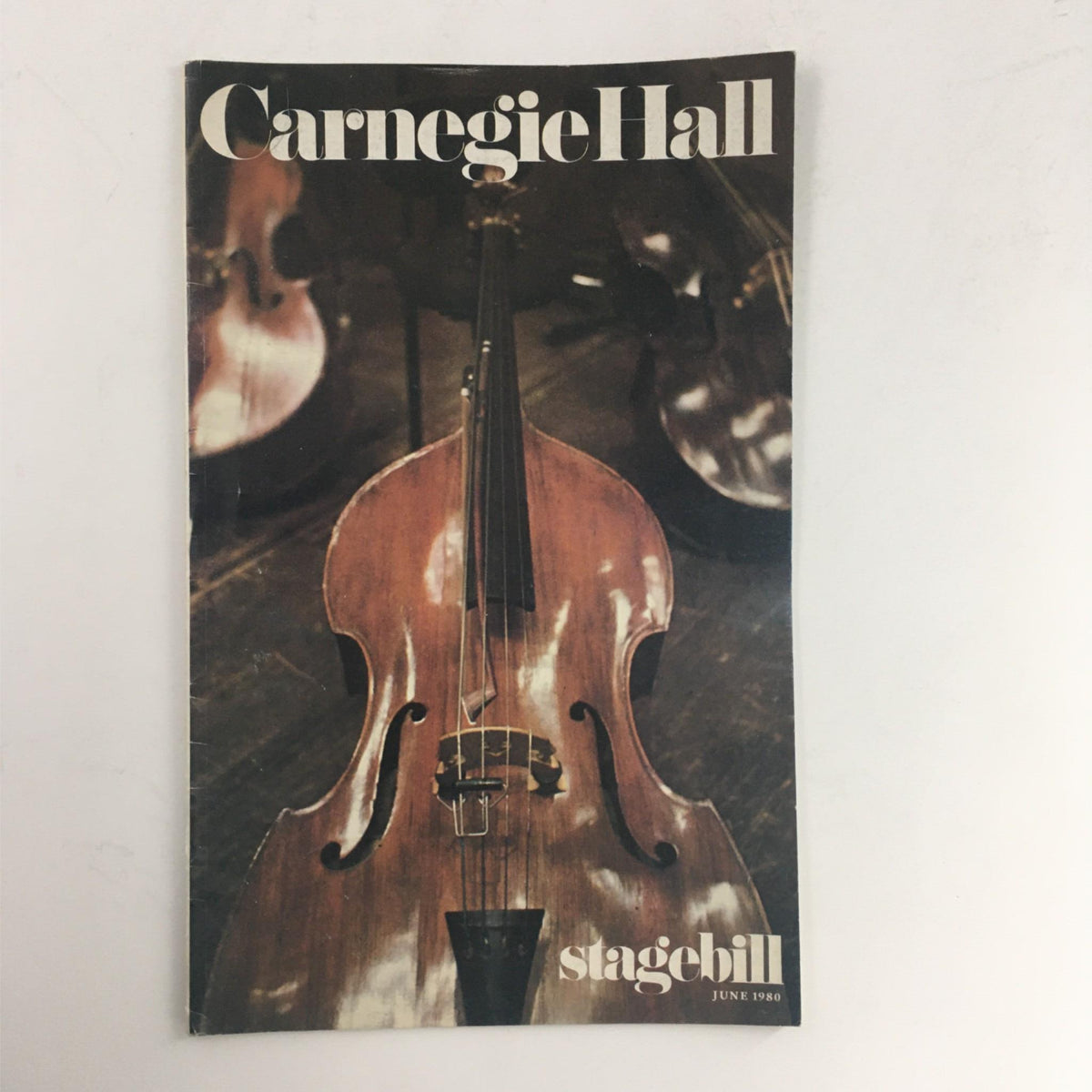 Cover of the 1980 Stagebill for Sinatra in Concert with Sergio Mendes at Carnegie Hall, featuring a close-up of a double bass and a warm, inviting atmosphere.