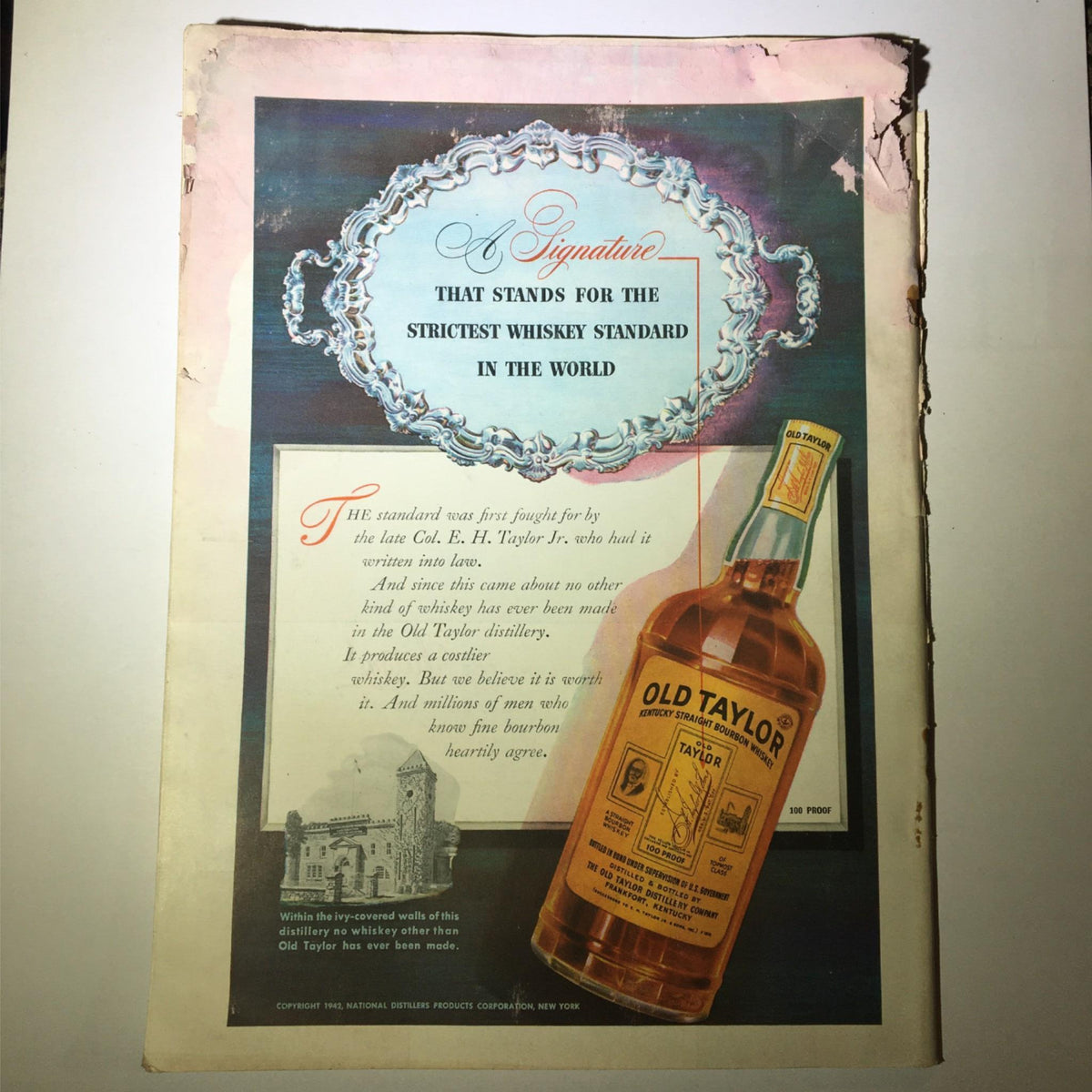 Back cover of the June 15, 1942 Newsweek Magazine displaying an advertisement for Old Taylor whiskey, with some age-related damage.