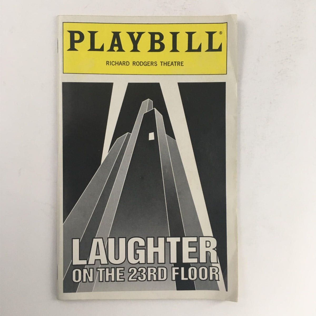 1994 Playbill for 'Laughter On The 23rd Floor' by Neil Simon, featuring a bold cover design with geometric shapes, showcasing the production at the Richard Rodgers Theatre.