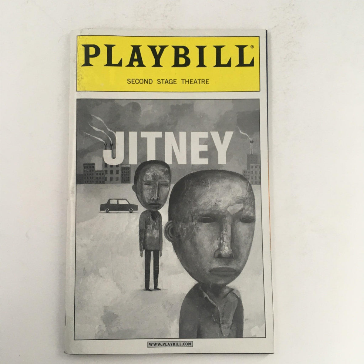 2000 Playbill for Jitney by August Wilson, featuring an artistic cover illustration depicting two figures against a city backdrop, presented by Second Stage Theatre.