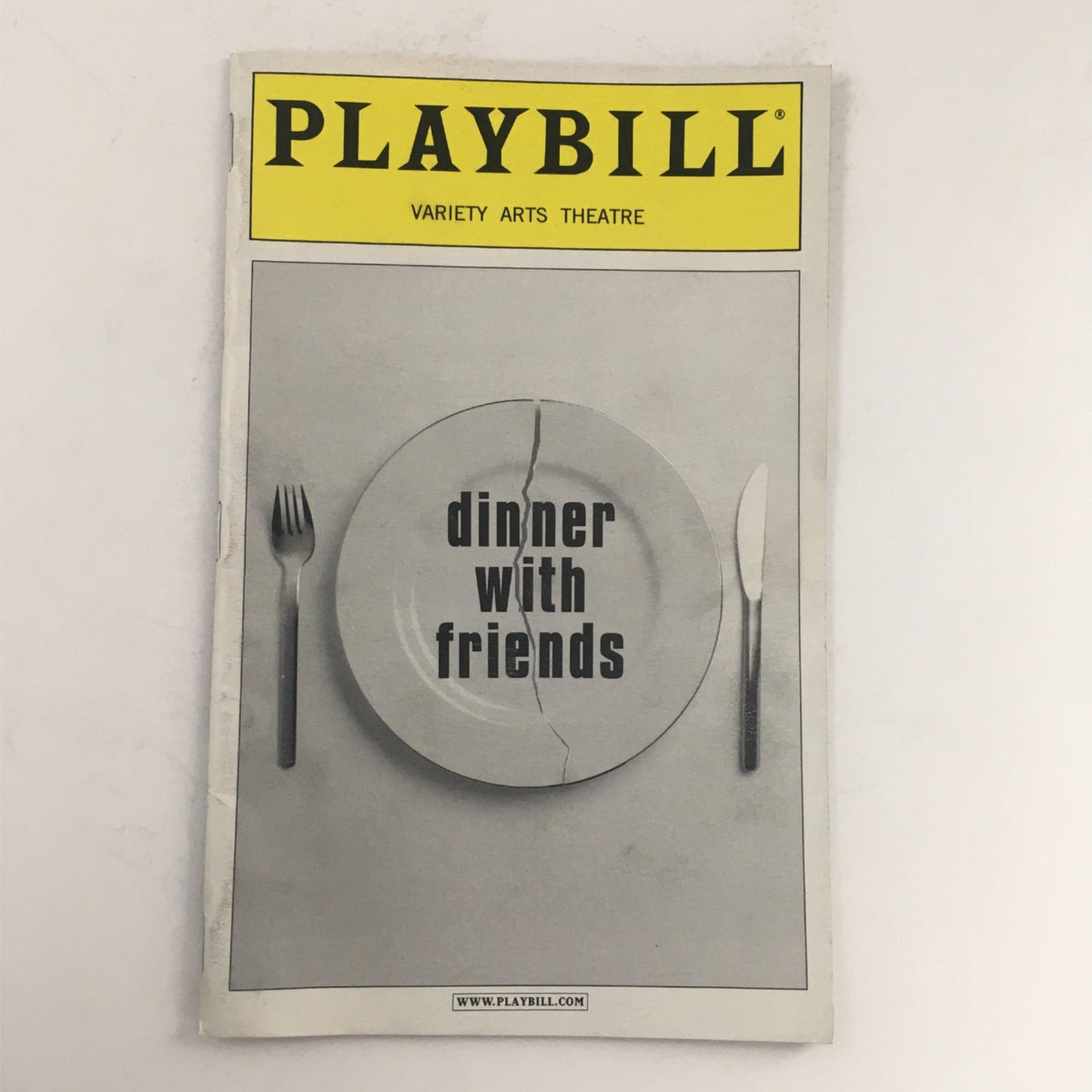 2001 Playbill for 'Dinner with Friends' by Donald Margulies featuring a minimalist cover design, displayed at Variety Arts Theatre.