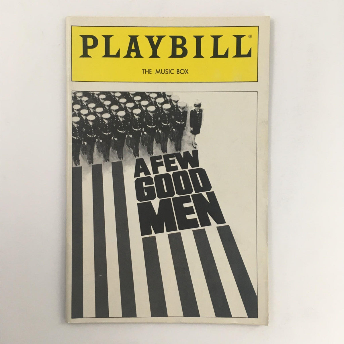 1990 Playbill for A Few Good Men featuring stylized cover with military figures and bold typography, representing the iconic drama by Aaron Sorkin at The Music Box Theater.