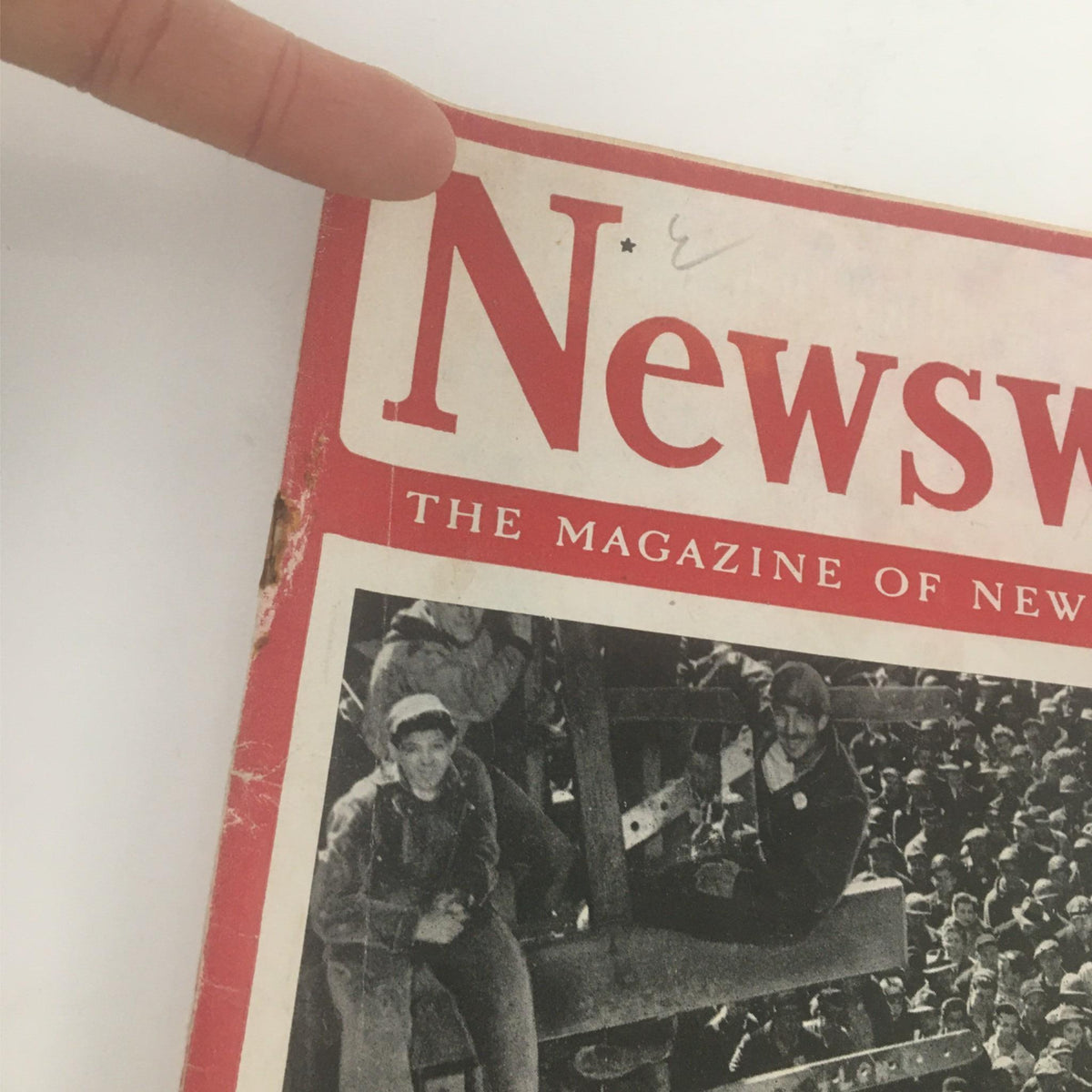 Close-up of the top section of the January 15, 1945 Newsweek Magazine cover, highlighting the title 'Wanted: More Men To Finish The Job' and a crowd of workers.