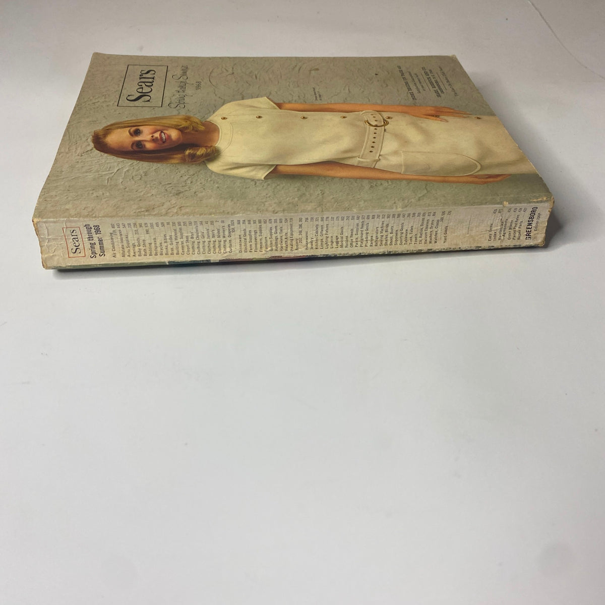 1968 Sears Spring Through Summer Catalog side view displaying the spine of the magazine, highlighting its original publication and vintage condition.