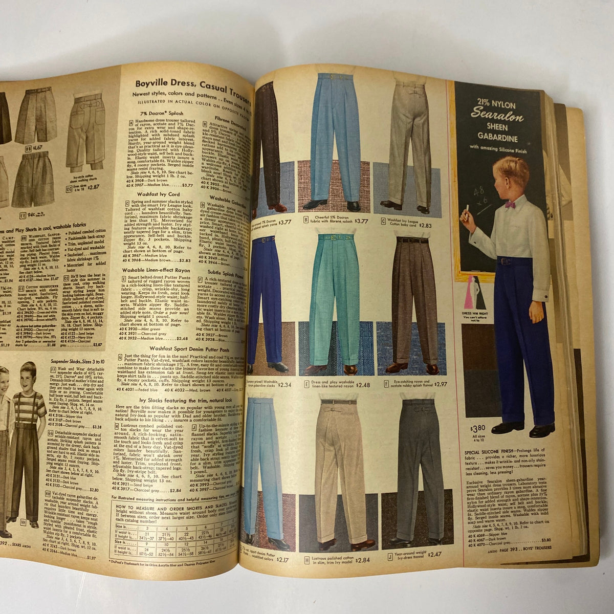 Page from the 1957 Sears Spring and Summer Catalog displaying an array of casual trousers for boys, showcasing mid-century clothing options.