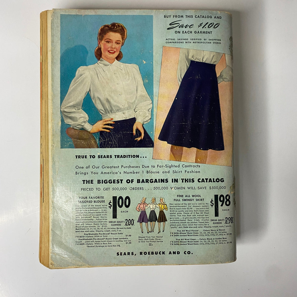 Cover page from the 1941 - 1942 Sears Fall and Winter Catalog featuring a woman in a blouse and skirt promoting bargain clothing offers, highlighting Sears' fashion trends during the early 1940s.