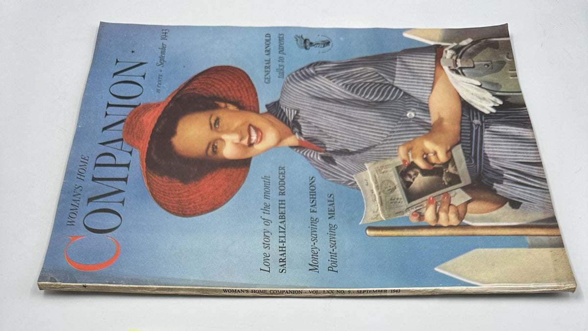 Side view of Woman’s Home Companion Magazine September 1943 showing the cover with a woman in a straw hat, headline about General Arnold and articles on money-saving fashions.