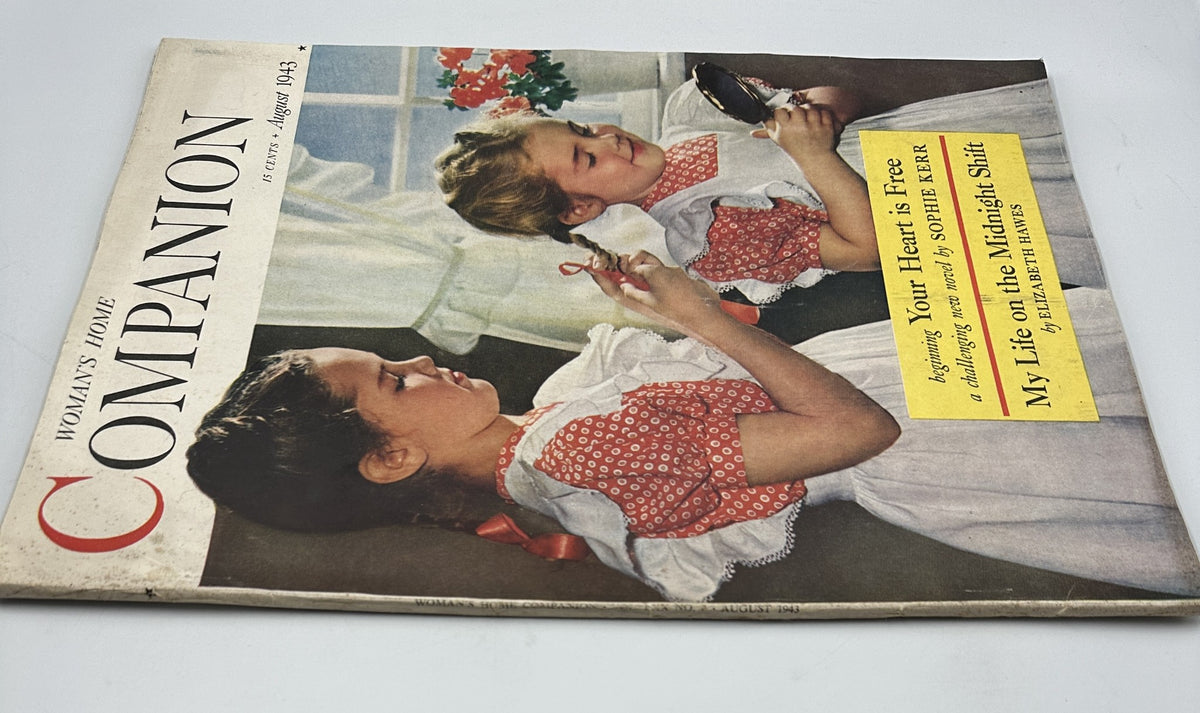 Close-up of the cover of Woman's Home Companion Magazine, August 1943 showcasing 'Your Heart Is Free' by Sophie Kerr and 'My Life on the Midnight Shift' by Elizabeth Hawes, featuring children in vintage attire.