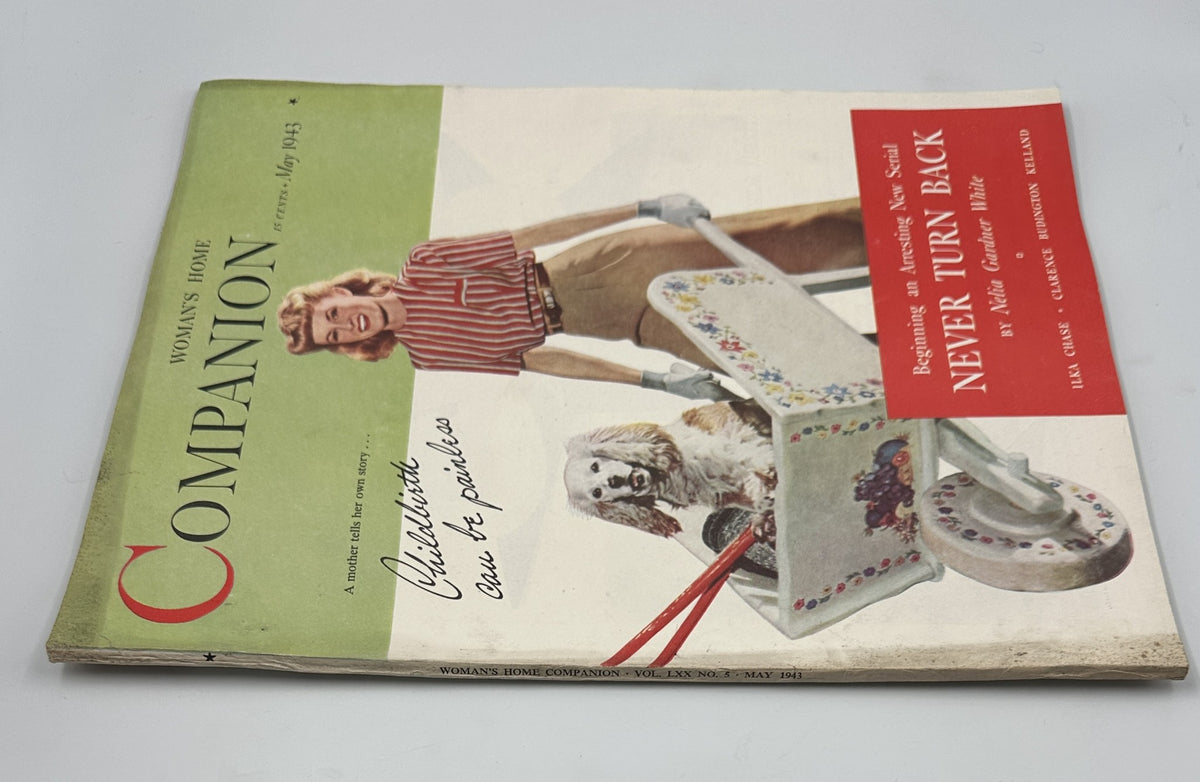 Woman's Home Companion Magazine May 1943 cover featuring a woman in stylish striped attire and a white dog beside a colorful lawn chair, emphasizing the theme 'Never Turn Back' by Nelia Gardner White.