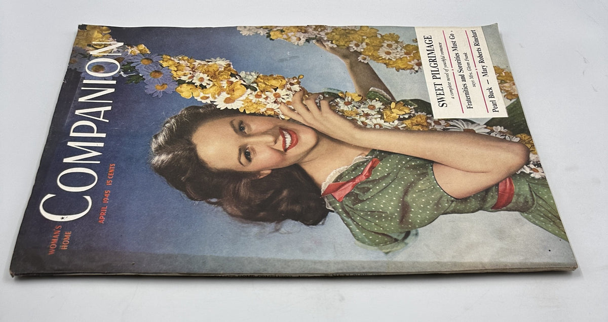 Cover of Woman’s Home Companion Magazine April 1945 featuring a smiling woman with flowers, showcasing 'Sweet Pilgrimage' by Pearl Buck.