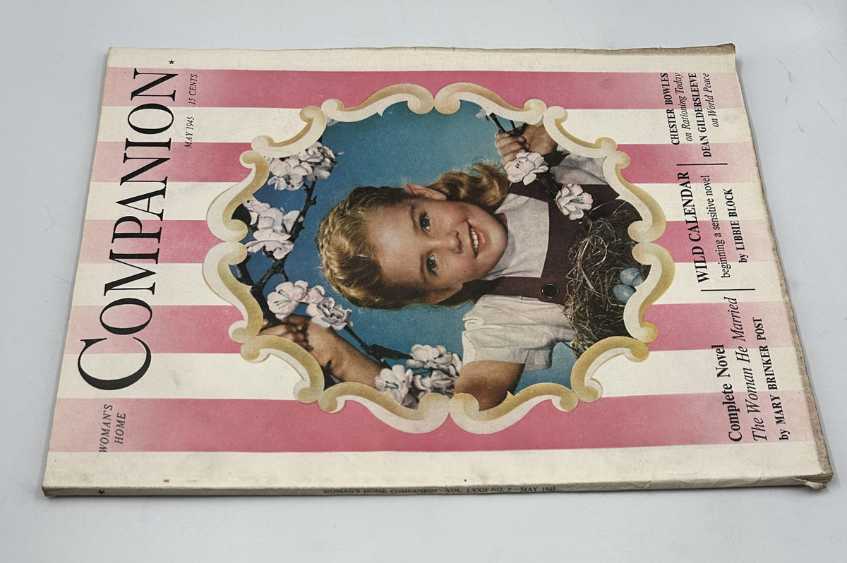 Alternate view of Woman’s Home Companion Magazine May 1945 showcasing Luana Patten on the cover, presenting the complete novel 'The Woman He Married' and the serial 'Wild Calendar,' adorned with pink stripes and floral decorations.